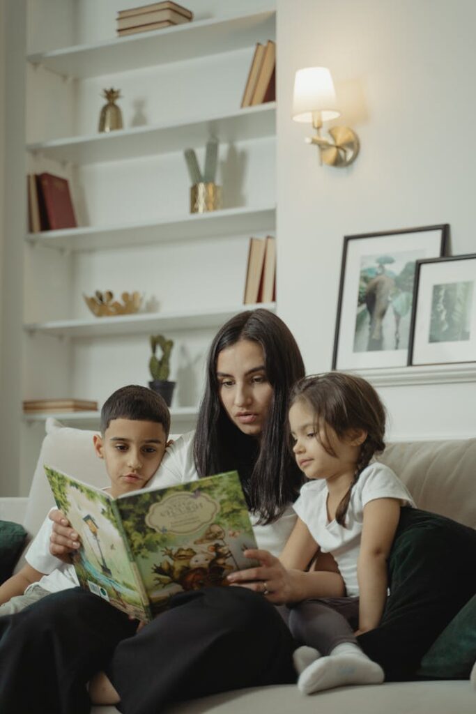 A mom reads to her children in the living room, highlighting bonding and educational moments.
